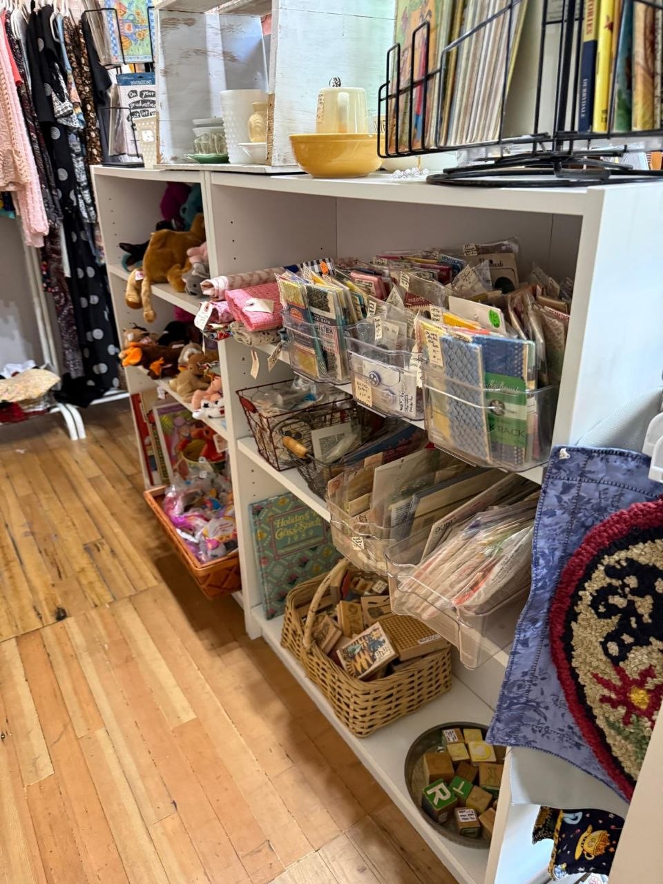 White cubby shelves full of small vintage goods