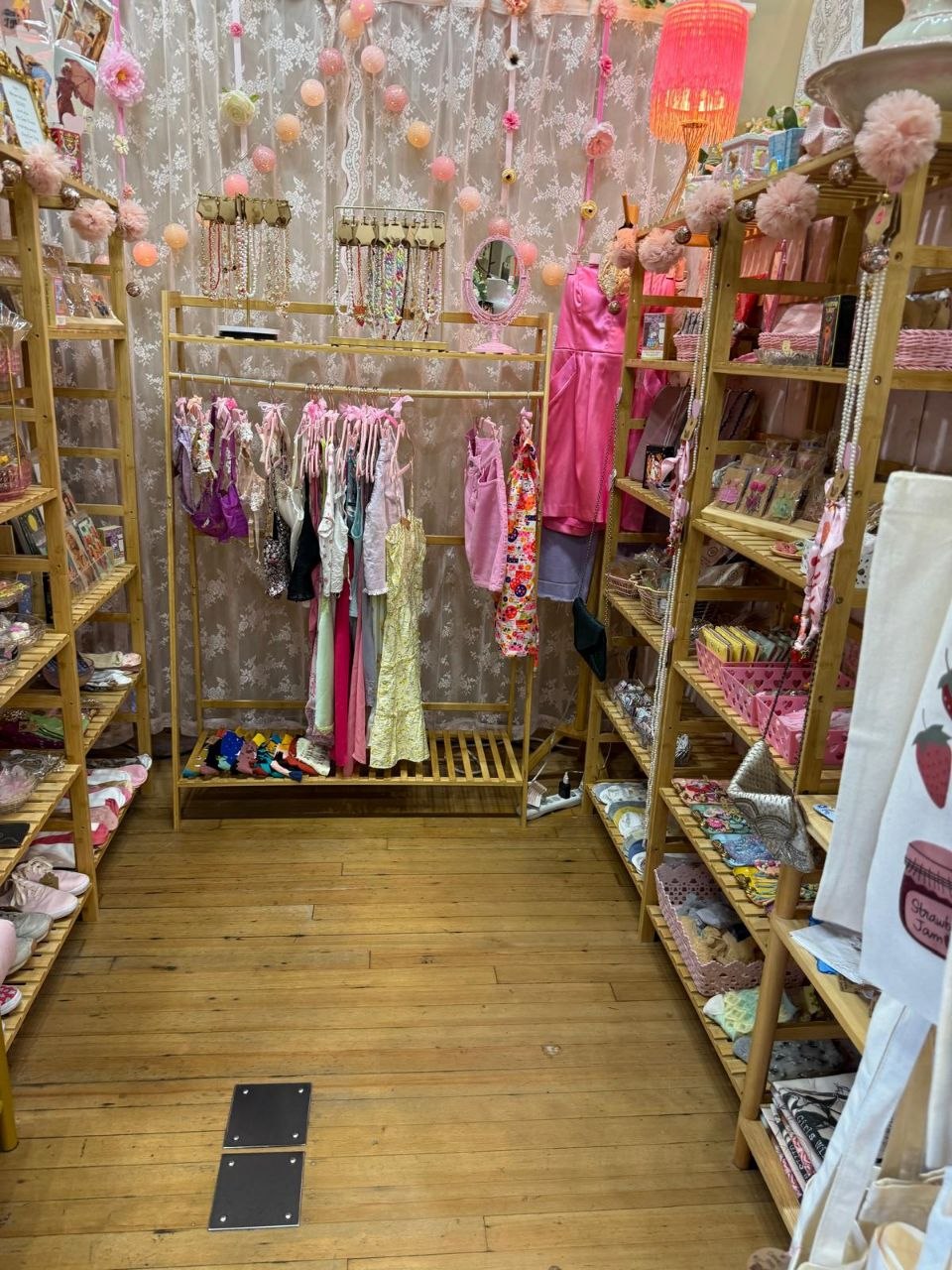 Vintage clothing and lace in a softly pink room