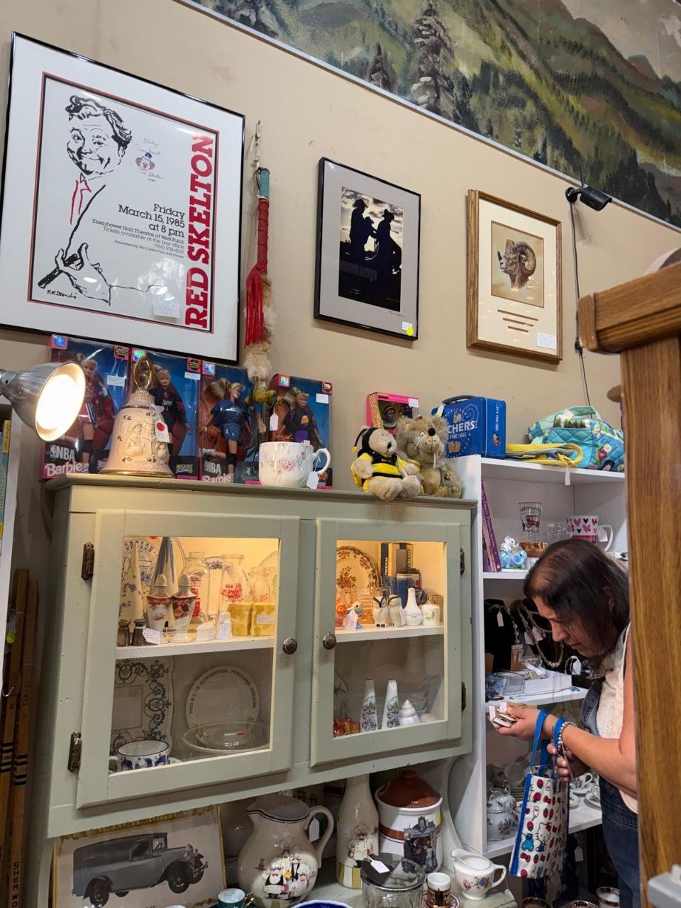 Glass case filled with vintage toys and collectibles